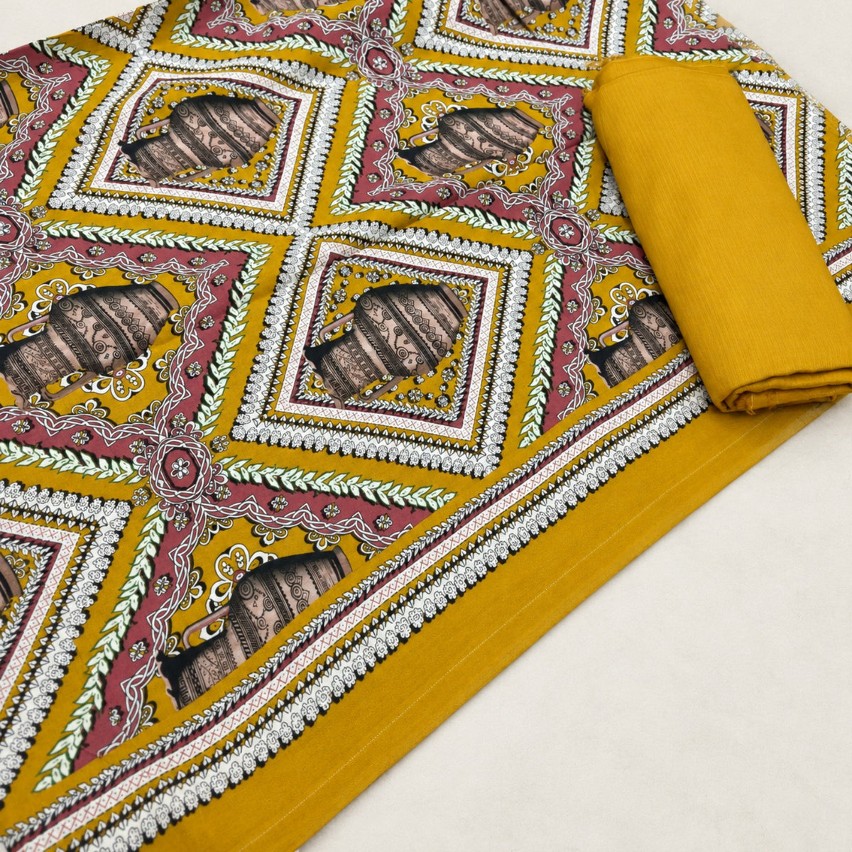 Nishat Mustard Geometric Printed Linen 2-Piece Suit at TANIAZE Special Price; mustard and pink geometric motifs with a solid mustard trouser.