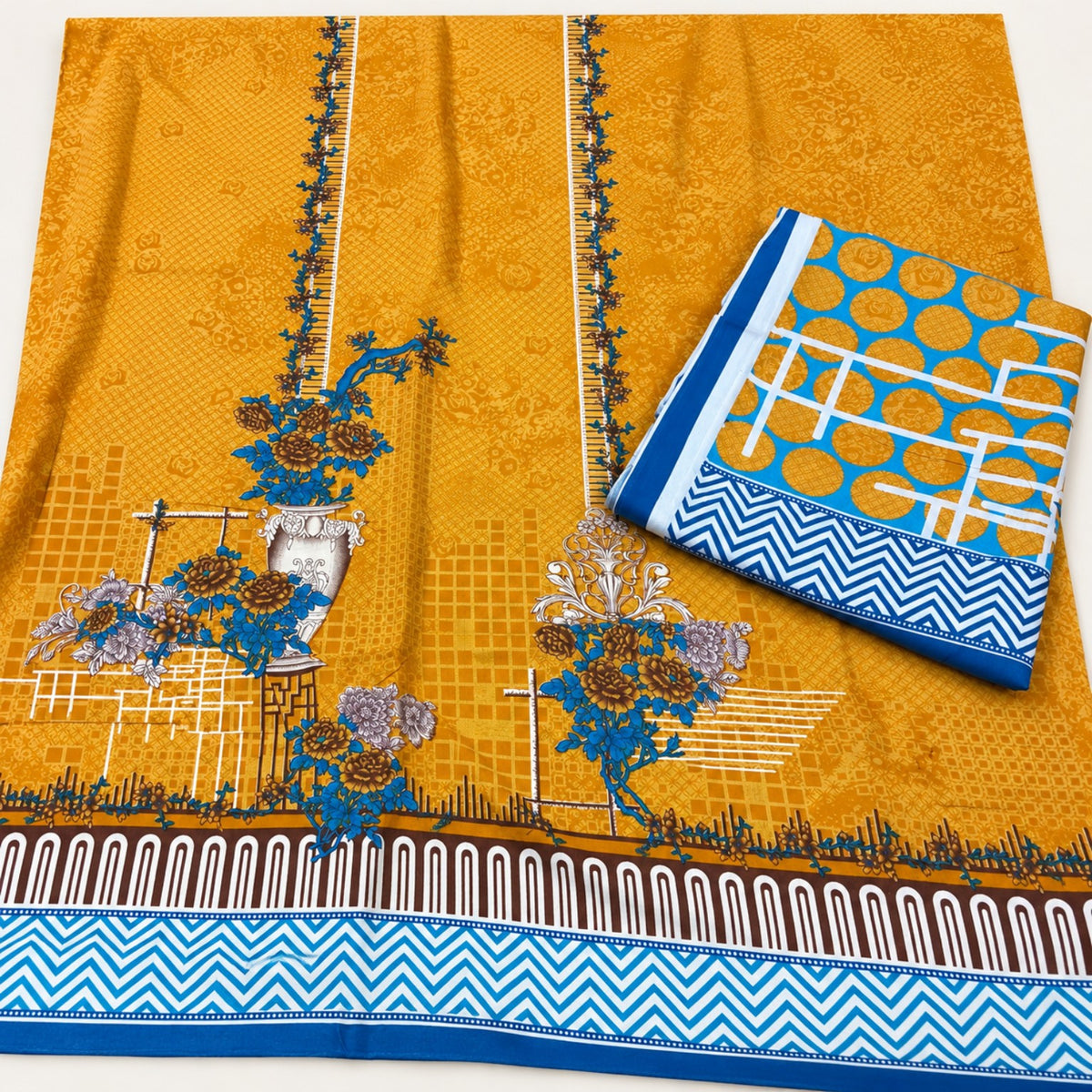 Gul Ahmed Mustard Printed Linen Shirt & Dupatta at TANIAZE Special Price; a mustard printed shirt with blue floral details and a blue-accented printed linen dupatta.