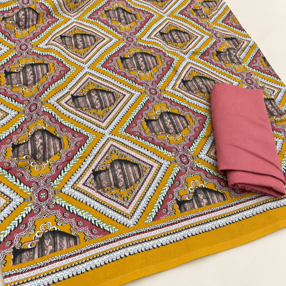 Nishat Pink & Mustard Printed Linen 2-Piece Suit at TANIAZE Special Price; pink and mustard geometric motifs with a solid pink trouser.