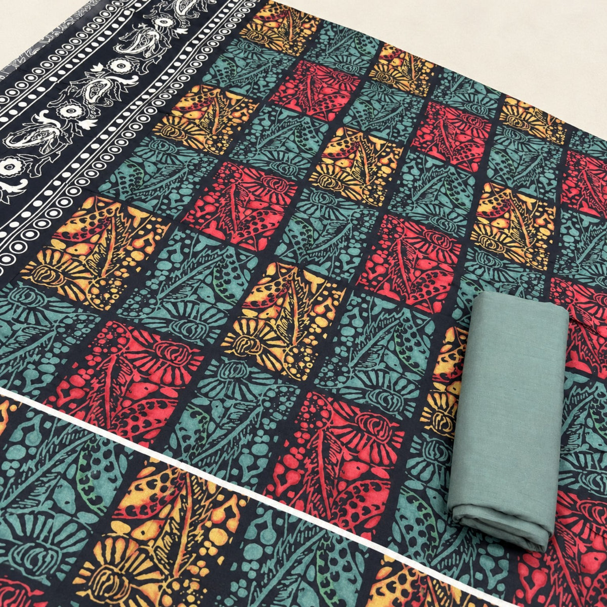 Nishat Multicolour Block Print Linen 2-Piece Suit at TANIAZE Special Price; red, teal and ochre patterned blocks with contrasting printed borders.
